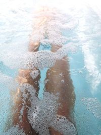 High angle view of people swimming in pool