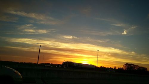 Silhouette of building against sky during sunset