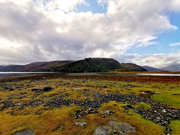 Scenic view of lake and mountains against sky