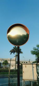 Low angle view of street light against clear blue sky