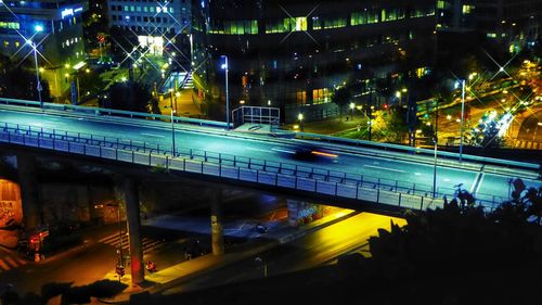 High angle view of light trails on road at night
