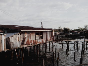 View of old hut on wooden posts over water