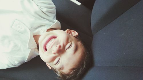 High angle portrait of boy on seat