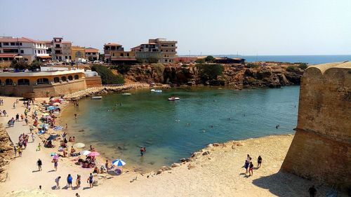 High angle view of tourists on beach