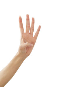 Close-up of hand over white background