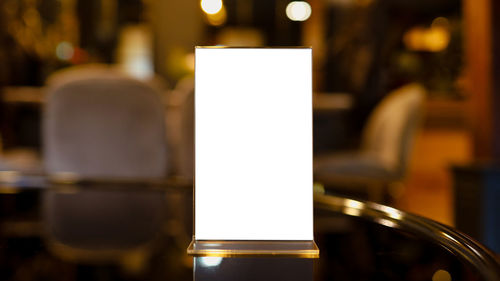 Close-up of wine glass on table at cafe
