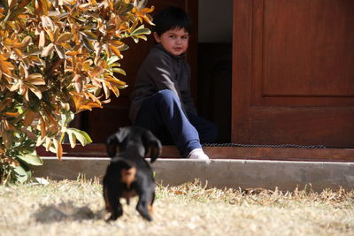 Full length of man with dog