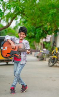 Lover boy playing with guitar. 