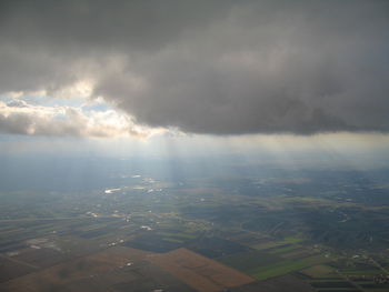 Aerial view of agricultural field against sky