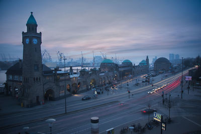 High angle view of street and buildings at sunset