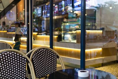 Empty chairs and tables in cafe