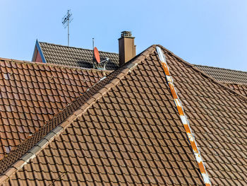 Low angle view of roof and building against sky