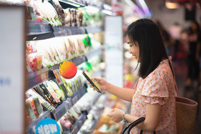 Side view of woman in store