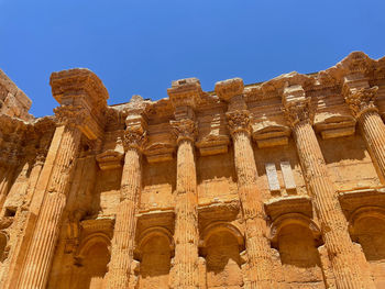 Low angle view of old temple against clear sky