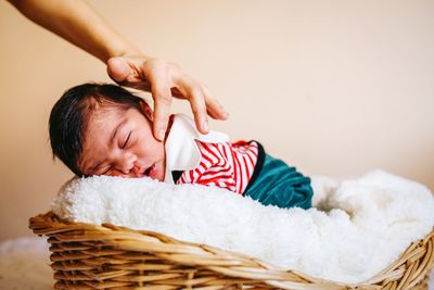 Portrait of cute boy relaxing in basket