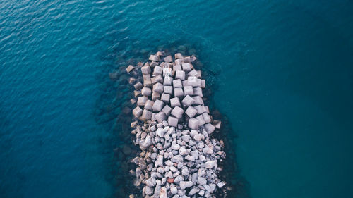 High angle view of wave breaker in sea