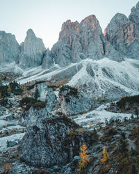 Scenic view of rocky mountains against sky during winter