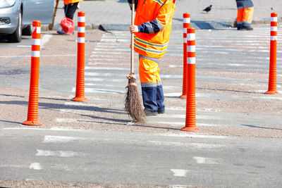 Low section of person working on road