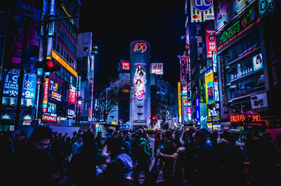 Low angle view of illuminated buildings at night
