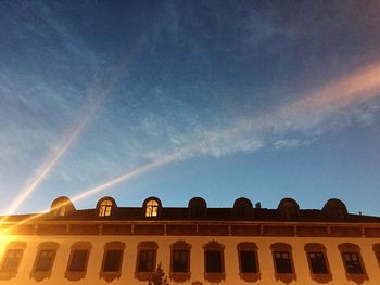 Low angle view of building against blue sky
