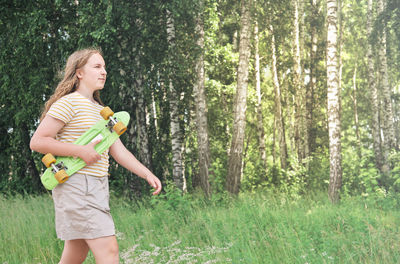 Full length of woman standing on field