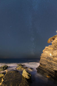 Scenic view of sea against sky at night