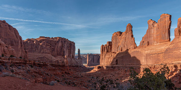 Towering rock formations known as park avenue in arches national park with awesome scenic views