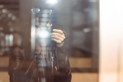 Close-up portrait of man holding glass