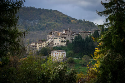 High angle view of townscape by mountains