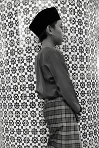 Side view of boy in traditional clothing looking away