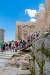 Group of people in front of historic building