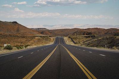 Empty road against sky