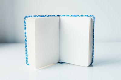 Close-up of open book against white background