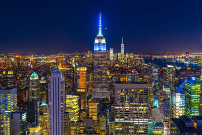 Illuminated buildings in city at night