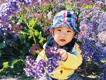 Portrait of baby with flowers