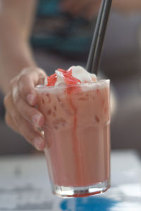 Close-up of hand holding drink