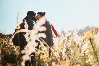 Couple sharing a passionate kiss while vacation trip. active leisure time close to nature