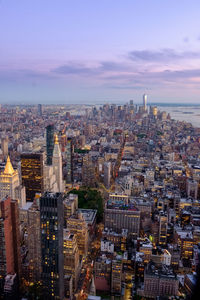 High angle view of buildings in city against sky during sunset