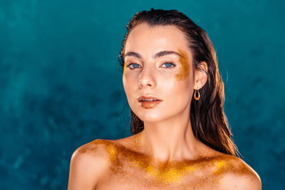 Portrait of beautiful young woman in swimming pool