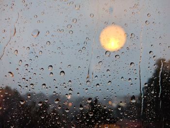 Full frame shot of wet glass window in rainy season