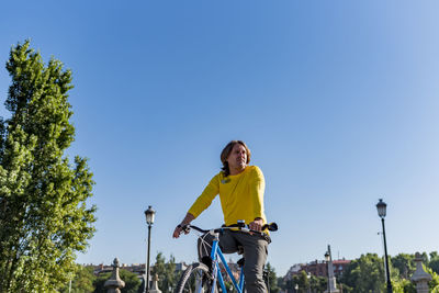 Caucasian man riding bicycle in the city