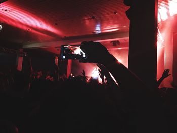 Close-up of hands at music concert