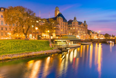 Illuminated buildings in city at night