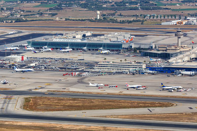 High angle view of airplane on airport runway