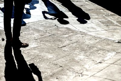 Low section of man standing on floor