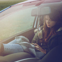 Woman sitting in car