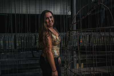 Portrait of smiling woman in an abandoned mine