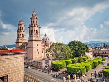 Buildings in city against sky