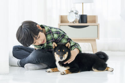 Man and dog relaxing at home