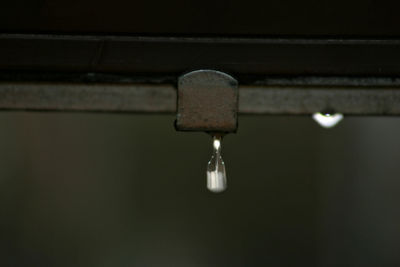 Close-up of water drops on rusty metal